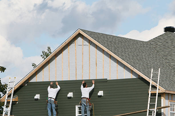 Professional Storm Damage Siding Repair technician working in North Canton, CT
